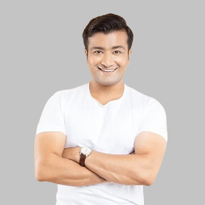 Smiling man with arms crossed