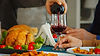 close-up-young-man-pouring-red-wine-his-father-family-gathering.jpg