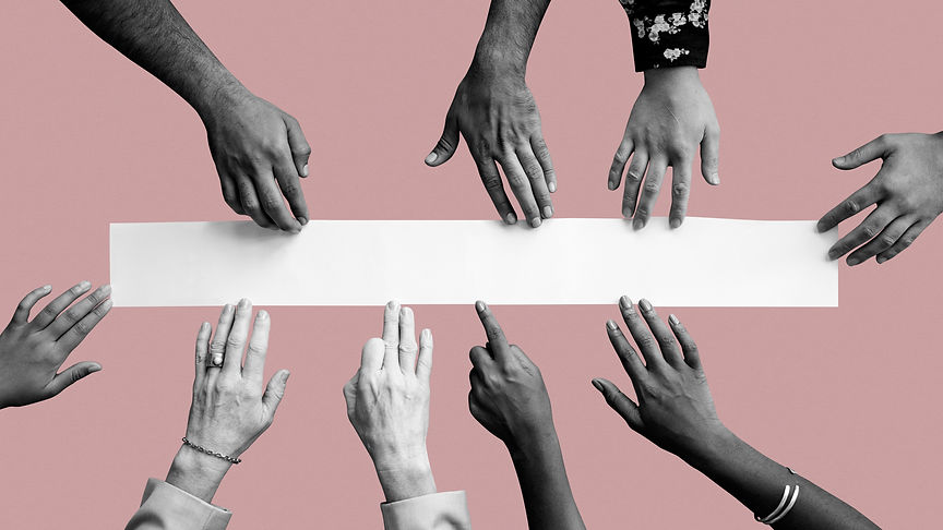 diverse-hands-touching-white-paper.jpg
