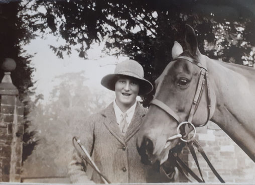 Monica with Jessy, one of her hunters, c. early 1920s..jpg