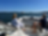 Couple sitting on boat.png