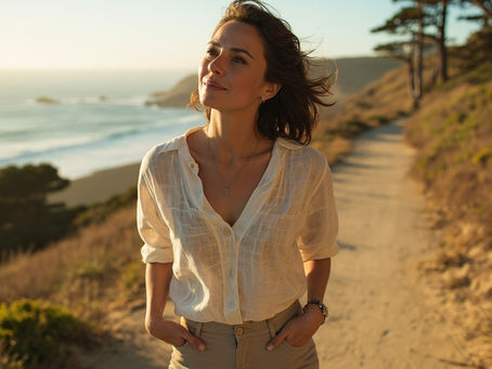 Woman walking along Monterey Bay coastal path at golden hour representing IV vitamin therapy wellness lifestyle at Majestic MD Spa