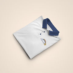 A close up of a white polo shirt with the Kidtensive PT logo on the breast