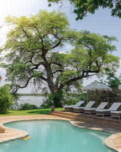 A beautiful swimming pool from Mpala Jena river lodge on the banks of the Zambezi