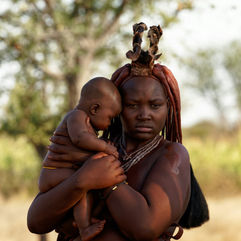 A local tribal woman comforting her baby