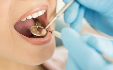 Dental patient smiling comfortably during nitrous oxide treatment by Dr. Rovi