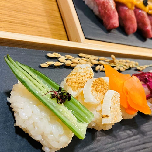 “Japanese-style private chef Niseko dinner – traditional dishes served in a cozy chalet dining room”