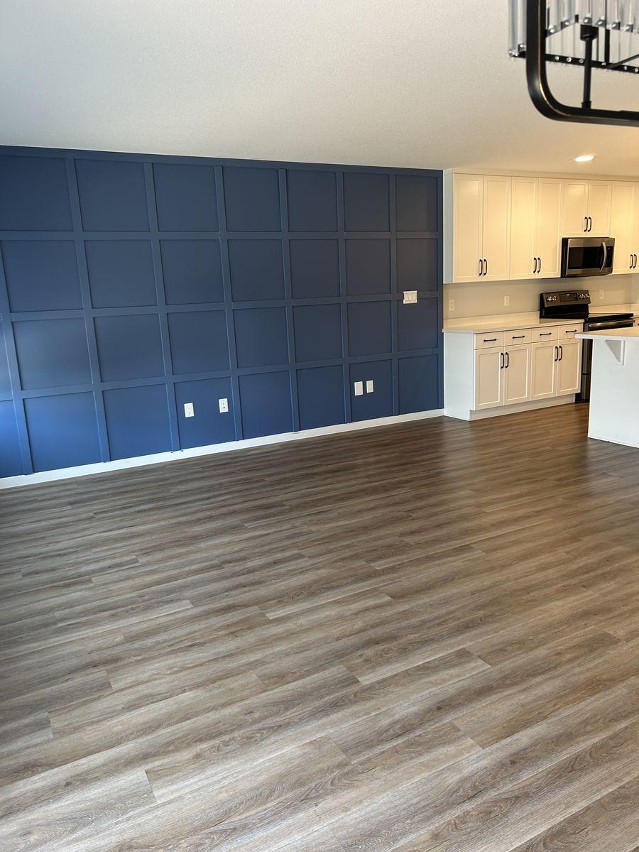 An empty living area with clean floors, ready for move-in