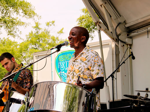 Stacy Loggins and Jan Knutson of Tobago Bay performing at the 2024 Herndon Festival