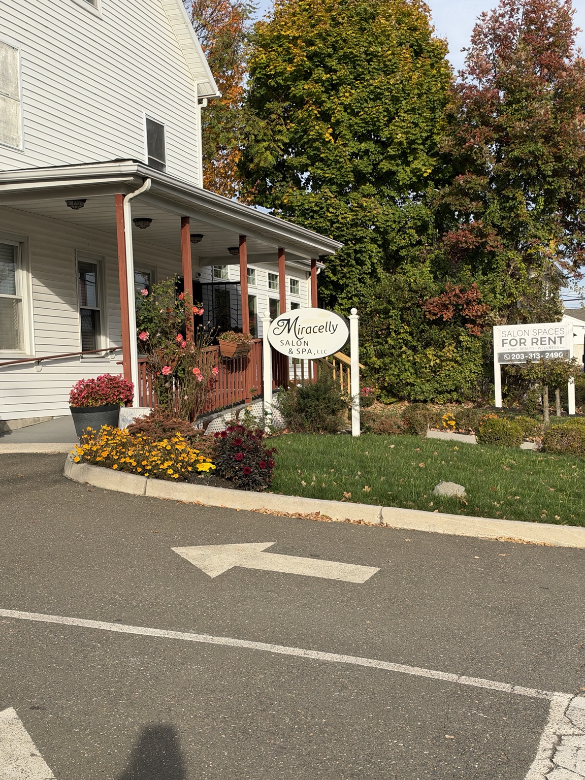 Miracelly Salon and Spa entrance, landscaped garden, and parking area