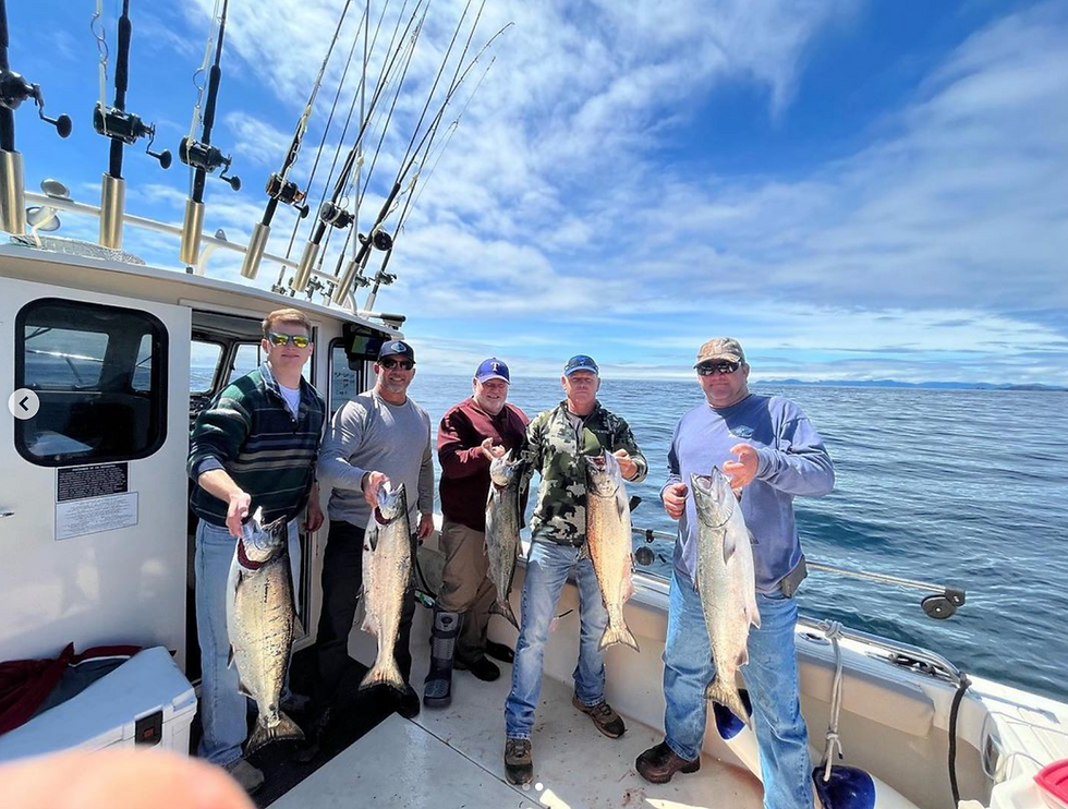 5 men holding up king salmon on a successful fishing trip in ketchikan alsaka