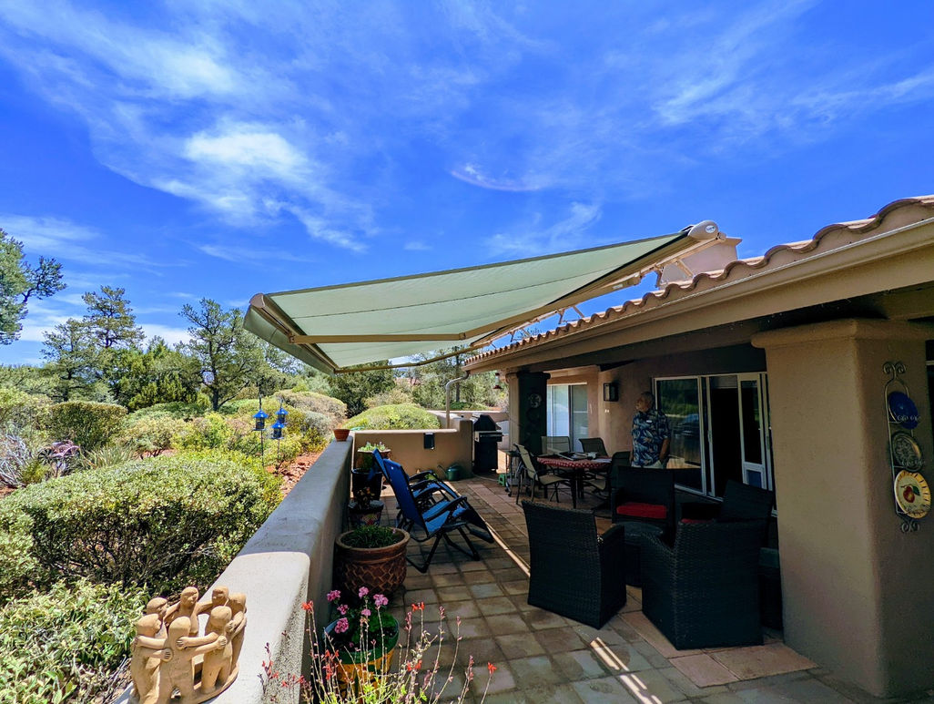 motorized awning covering a back patio