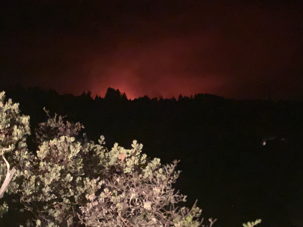 Fire glow from CZU Lightning Complex Fire near Alba Rd outside of Ben Lomond, California
