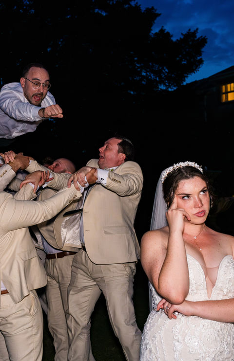 Groom lifted by groomsmen; bride looks on LUX Wedding Photography, North East wedding Photographers, wedding photographers in the north east, Newcastle, Northumberland and Durham