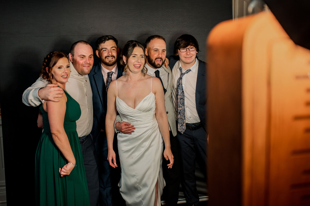 bride and groom using a Photo Booth 