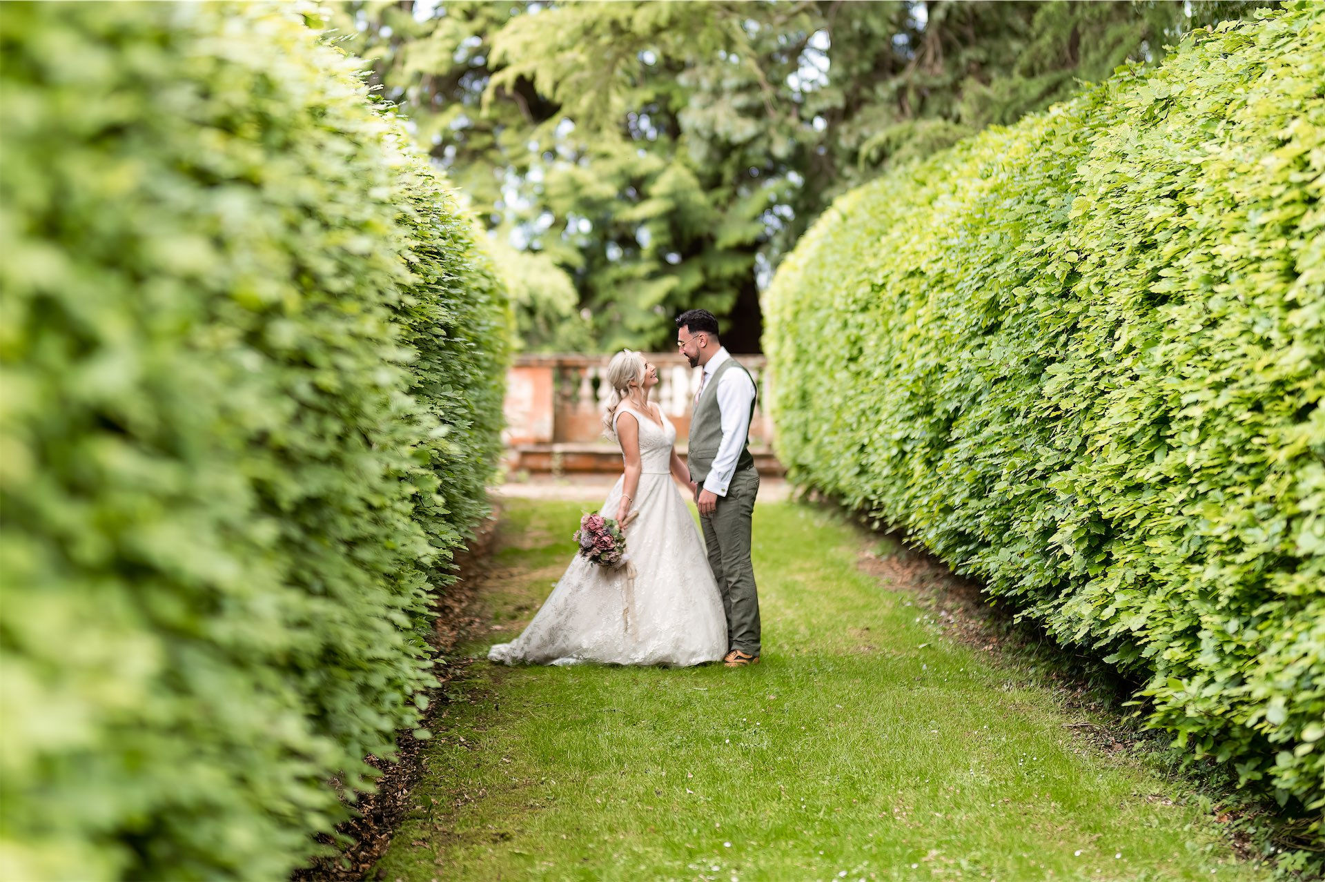 Romantic wedding couple in lush garden