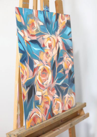 Side view of abstract yellow roses in Winter Garden by Catherine Snowstorm on an easel. Highlights the canvas depth and texture in a studio.