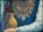 Ukrainian folk art oil painting Dukachi by Catherine Snowstorm. Close-up of a traditional red coral necklace, ethnic attire, and a clay jug.