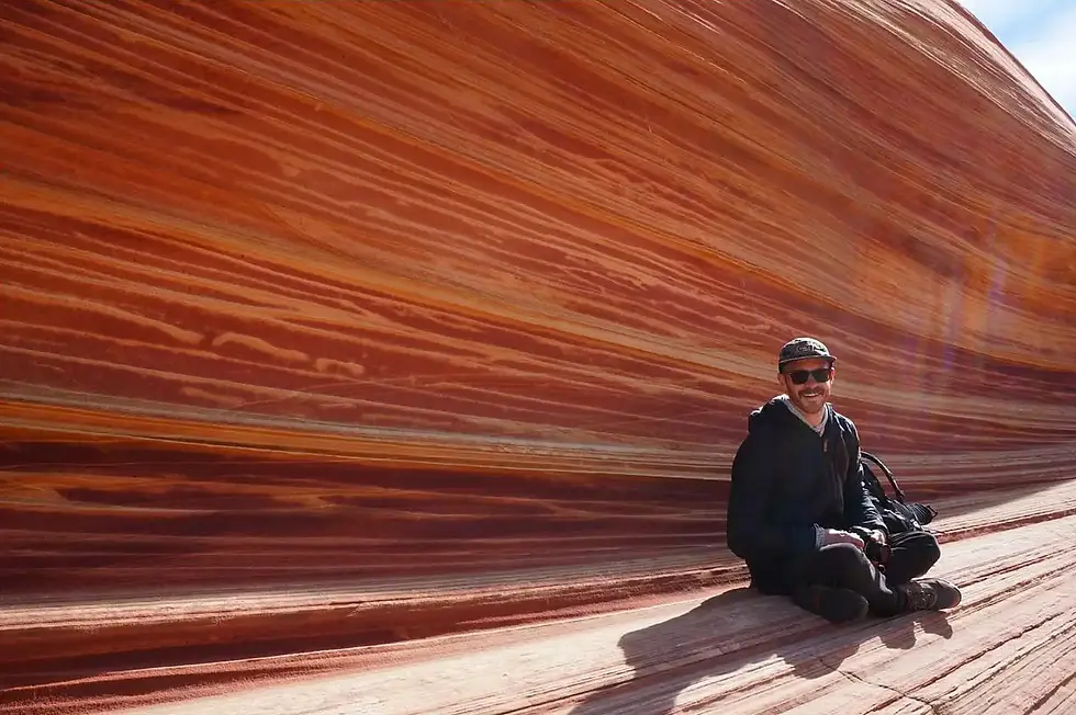 TJ Smith sitting at the Wave formation in Arizona.