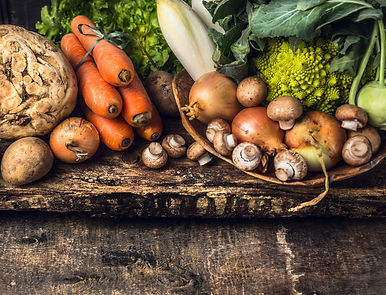raw vegetables and edible root various on dark wooden rustic background.jpg