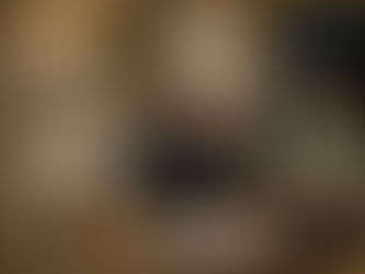 Couple cooking together in kitchen laughing and bonding over shared activity