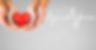 Digital composite of Heart beat over hands holding heart.jpg