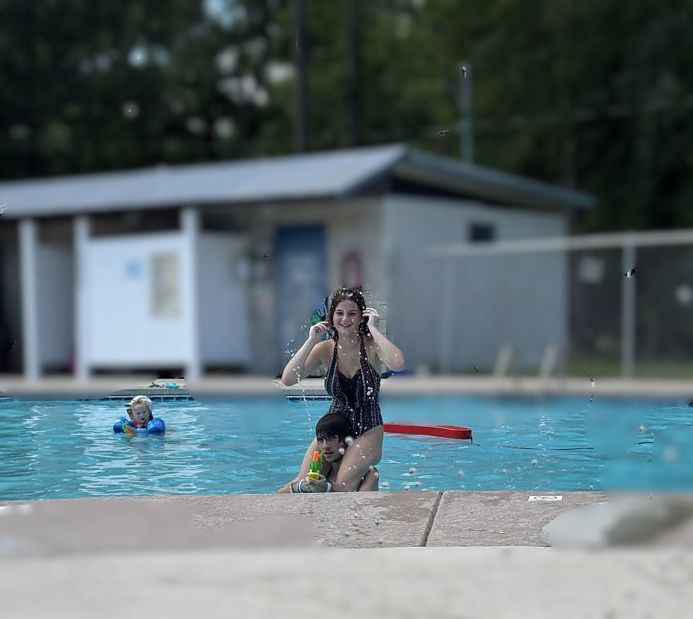 Jordan Bennett and Adison  and Sutton splash around in the pool. (photo by Tiffany Bennett)