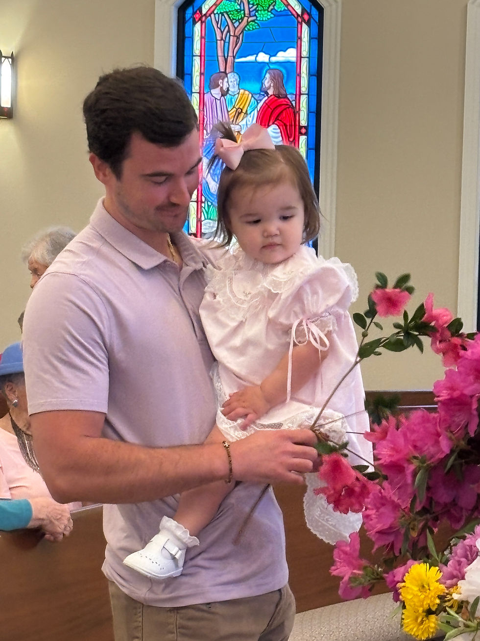 Worth Cowell and his Sweetie help flower the cross.