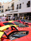 Luxurious cars parked in front of El Gaucho de Banús in the front line of Puerto Banús Marbella