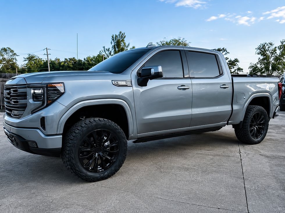 Gray GMC Sierra HD with color-matched OEM fender flares installed