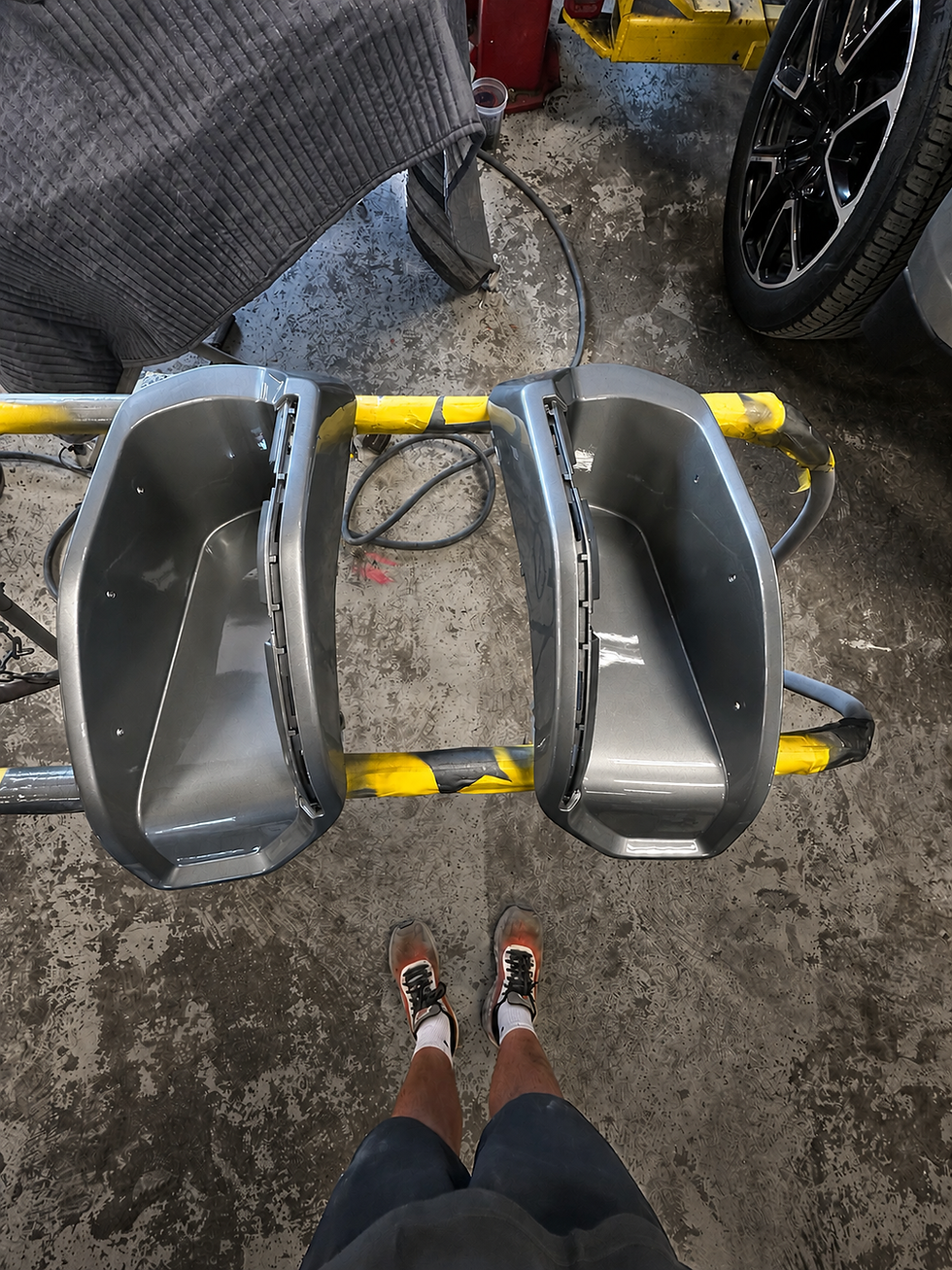 Unpainted GMC Sierra HD rear bumper step surrounds before custom color matching / painting