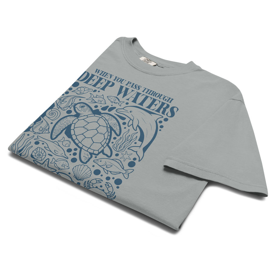 Christian t-shirt with blue ocean artwork, sea turtle illustration, and Isaiah 43:2 Bible verse deep waters design.