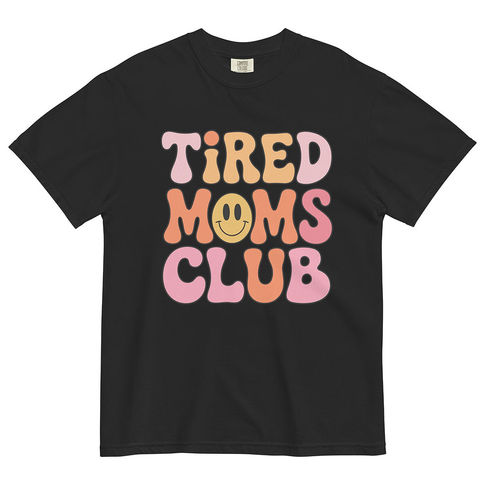 “Tired Moms Club graphic t-shirt in solid black, featuring a wavy retro 70s typography design with a small yellow smiley face