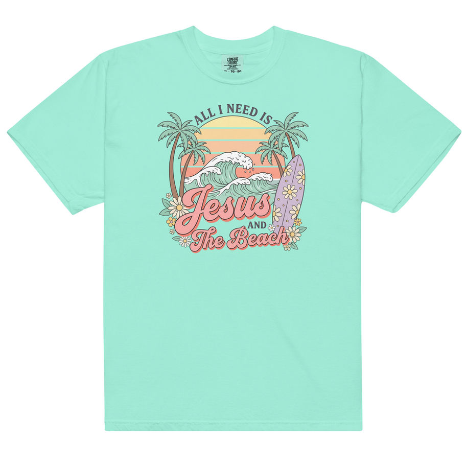 Christian graphic t-shirt featuring “Jesus and the Beach” tropical beach design with palm trees, sunset colors, and coastal s