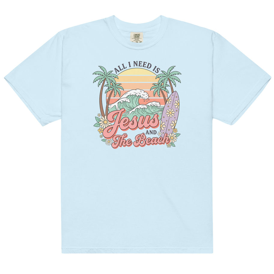 Christian graphic t-shirt featuring “Jesus and the Beach” tropical beach design with palm trees, sunset colors, and coastal s