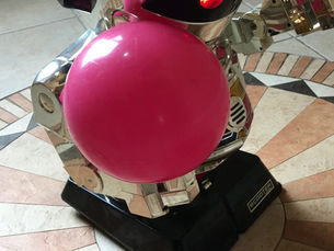 AI robot plays ball with dog