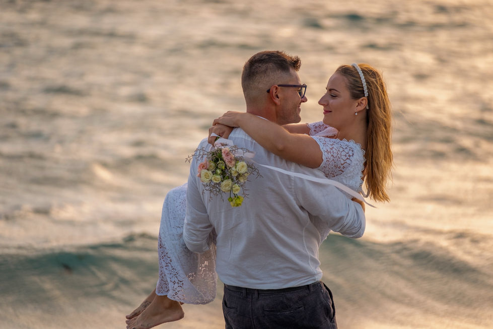 Sunset beach wedding portrait with dramatic sky in Fremantle