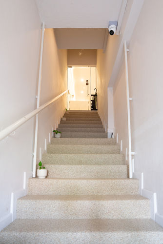 Terrazzo staircase leading to K’s Parlour beauty studio