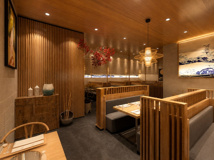 Timber dining booths with red blossom branches at Dinguoguo Hotpot in Singapore