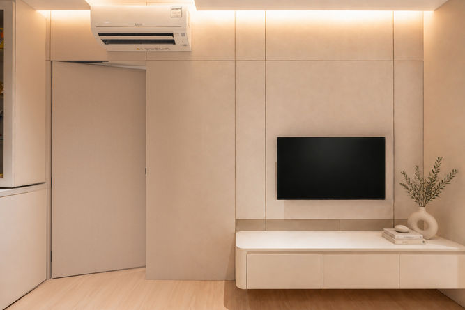 Warm minimalist living and dining interior at Woodgrove Ascent by Soil Studio Singapore