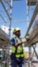 "Certified scaffold erector in full PPE and safety harness securing a plank during practical SAQA 263245 NQF Level 3 training at Swift Skills Academy Cape Town."