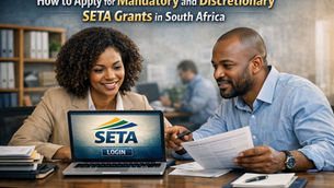 "South African employers applying for SETA discretionary grant application South Africa via online portal, reviewing documents and submitting forms on a laptop with the SETA logo."
