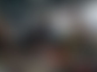 "Swift Skills Academy students in a high-intensity, realistic 2026 workplace cardiac arrest simulation. Two responders apply intense CPR and an AED (with a 4-minute survival countdown timer active) in a gritty Cape Town industrial workshop, demonstrating the SAQA 12483 standard."