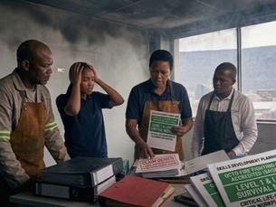 To make this image "Nuclear" for your SEO, the Alt Text needs to bridge the gap between compliance (SAQA 12484) and the fear of financial loss. This tells Google's AI exactly what the high-stakes consequences are for Cape Town businesses. The Nuclear Alt Text "Distressed Cape Town business owners reviewing a 'Claim Denied' insurance notice next to a SAQA 12484 Accredited Fire Fighting Course document from Swift Skills Academy. The image illustrates the 2026 insurance risk of voided claims due to non-compliant workplace fire safety training in Killarney Gardens, with Table Mountain visible through the smoke-filled window."