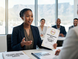 A confident Swift Skills Academy graduate presenting her NQF Level 4 QCTO Workplace Essential Skills certificate (SP-211009) to a Cape Town interviewer with Table Mountain in the background. The image represents the 20-day job winning blueprint for South African youth seeking careers in Killarney Gardens.
