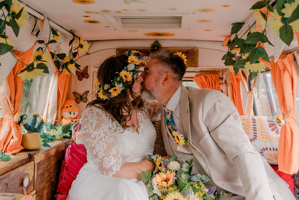 Bride and groom Wedding sedgewell Barn North Yorkshire camper van decorated with orange flowers 