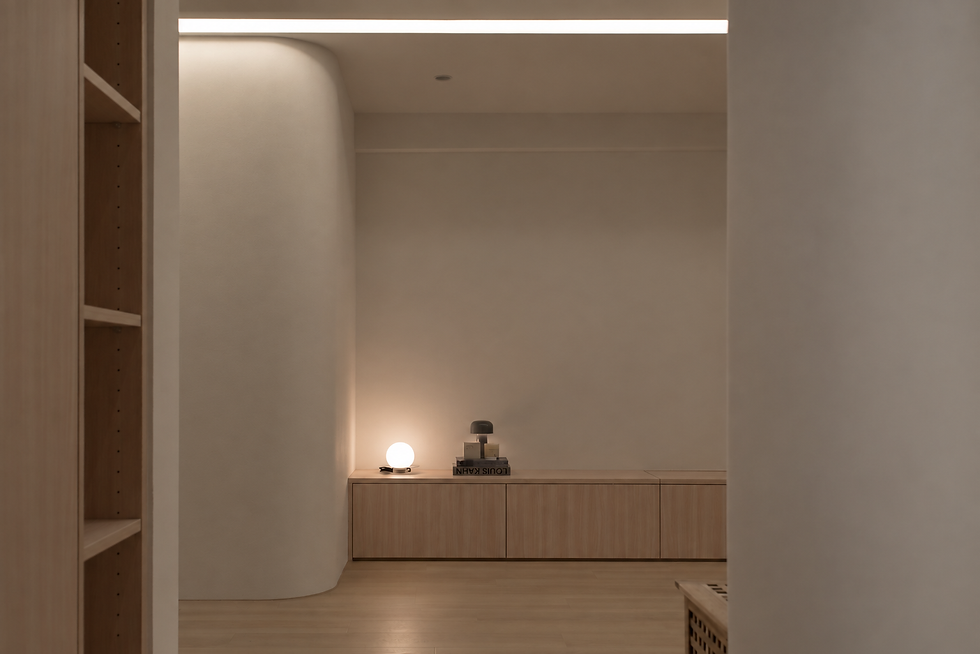 Warm residential interior with recessed lighting and a softly illuminated wall niche