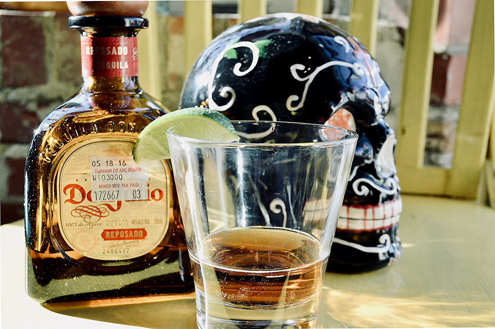 shot glass of reposado tequila at Dos Perros in Durham