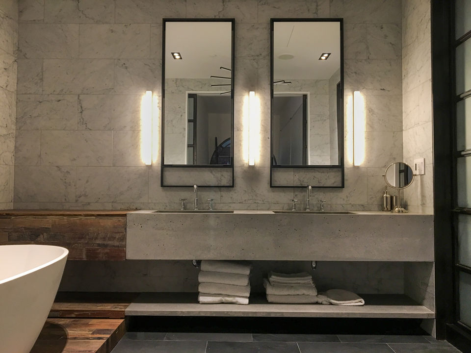Concrete double sink by Concrete Shop, RAAD Design Tribeca NYC project — troweled top with raw form-finished front showing natural variations.