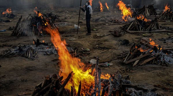 Bodies burning onpyres in East Delhi